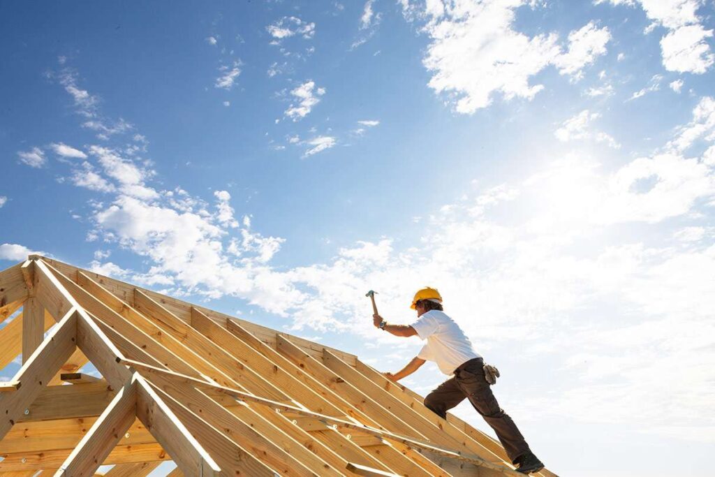 man working on roof repairs